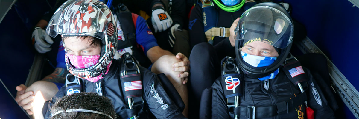 Andrew Happick and Christy Frikken riding up to altitude before 4way training